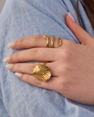 Stainless steel gold-tone snake ring and chunky crocodile textured statement ring set on hand